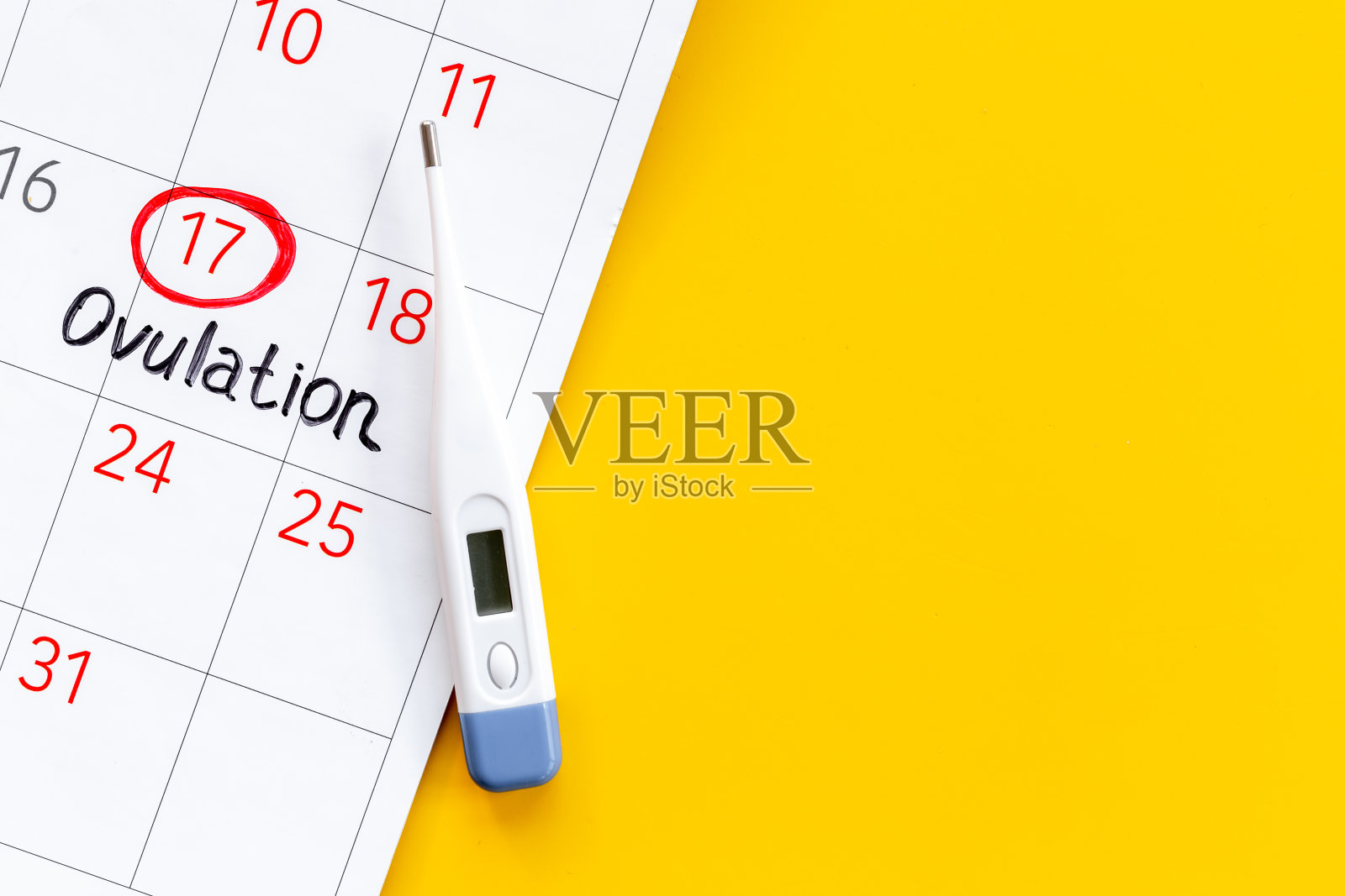 女性经期日历上有排卵字和体温计。怀孕计划背景照片摄影图片