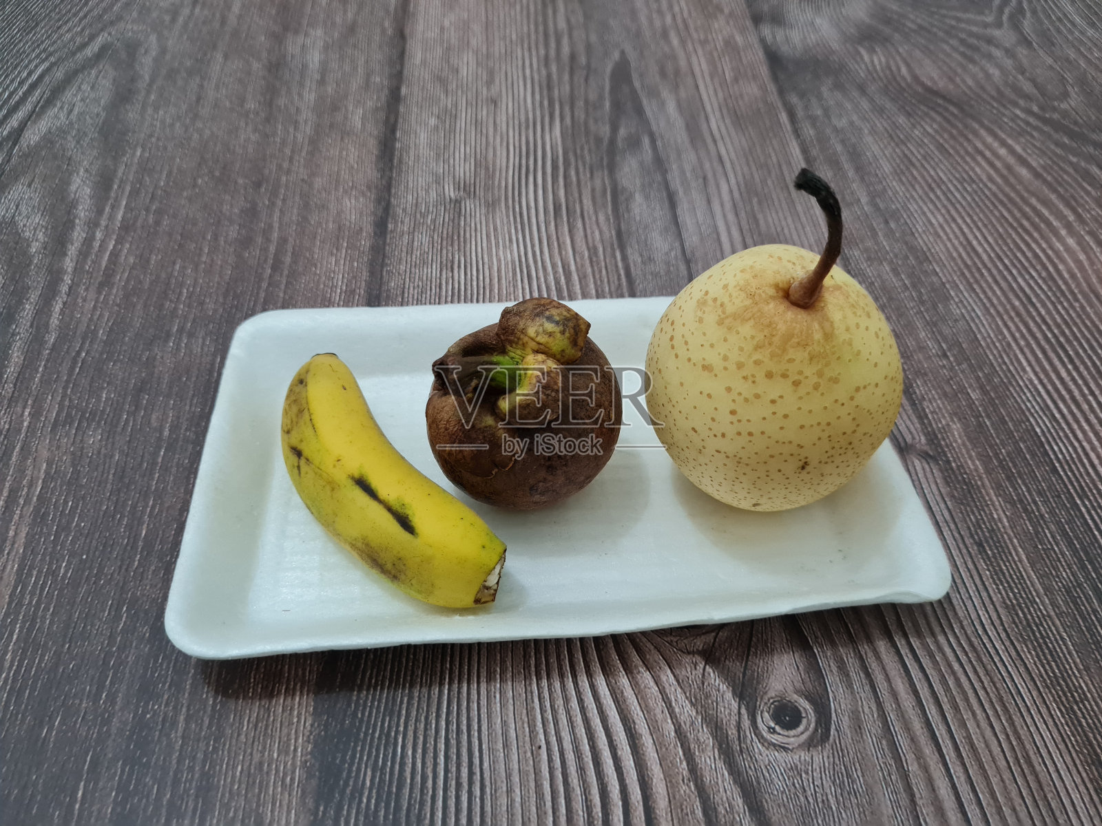 香蕉,山竹果和梨照片摄影图片