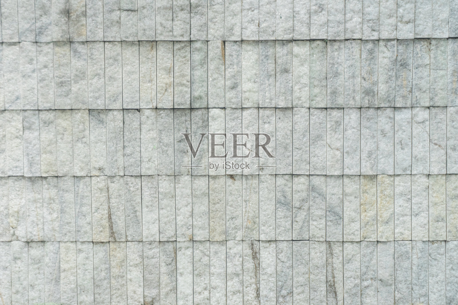 石墙浅灰色混凝土外部石覆层细节特写背景照片摄影图片