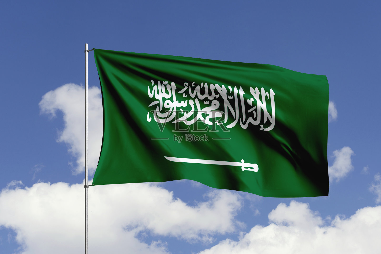 沙特阿拉伯国旗在风中飘扬。照片摄影图片