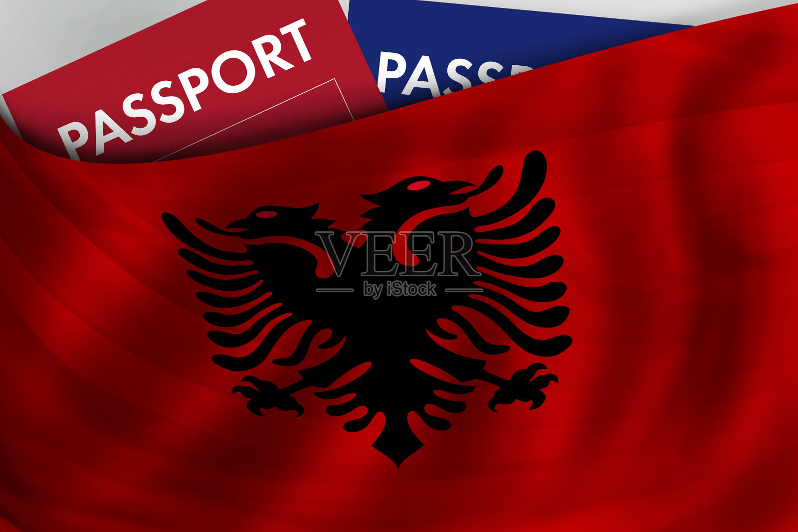 阿尔巴尼亚国旗背景和阿尔巴尼亚护照。公民身份,官方合法移民,签证,商务和旅游的概念。照片摄影图片