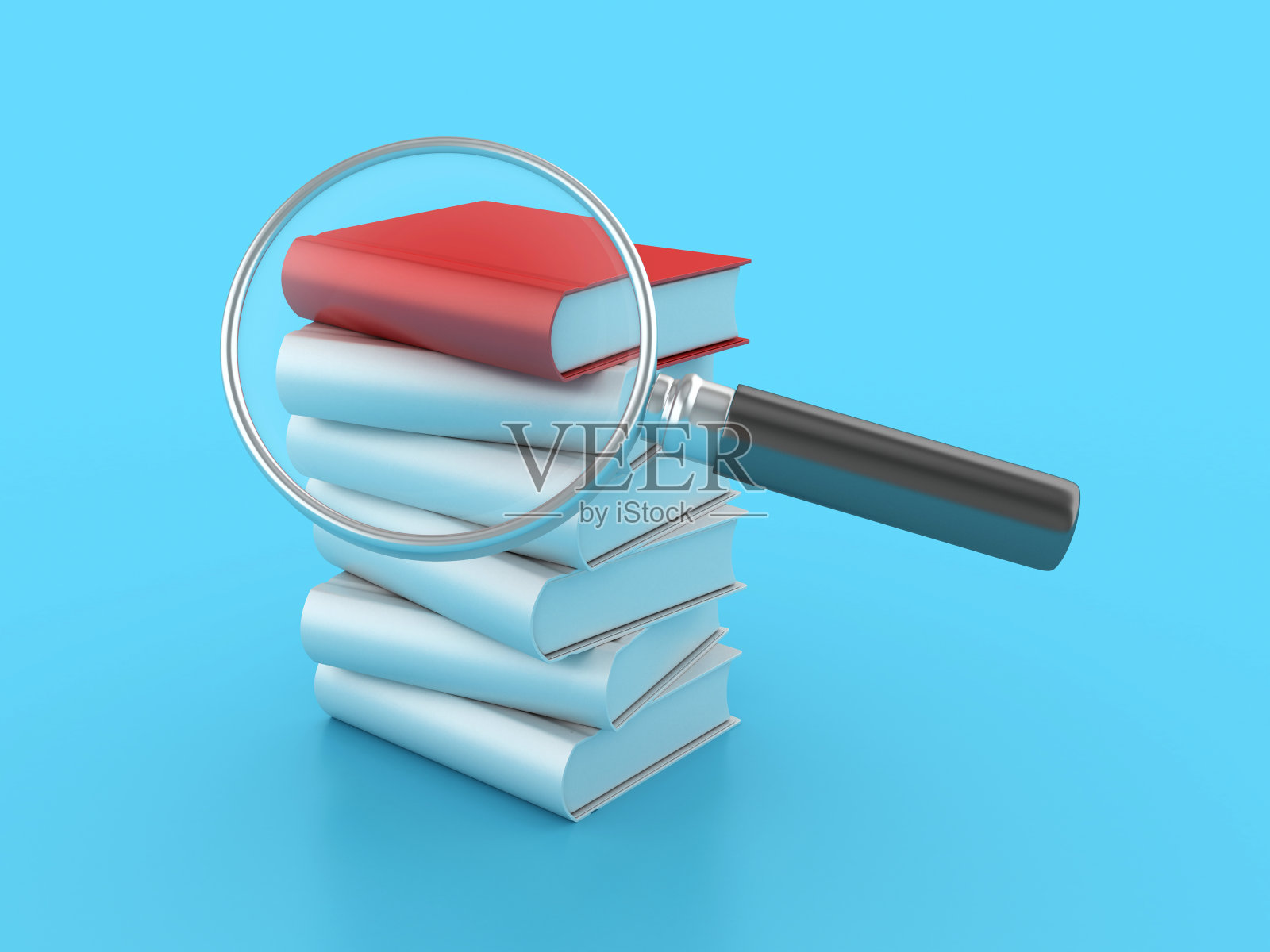 一叠带放大镜的书照片摄影图片