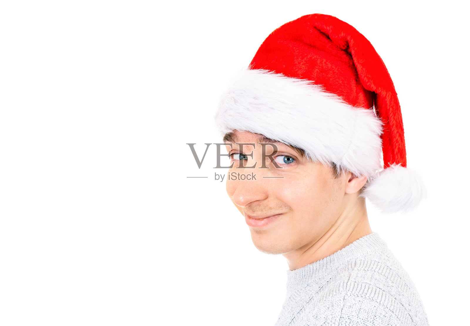 戴圣诞帽的年轻人照片摄影图片