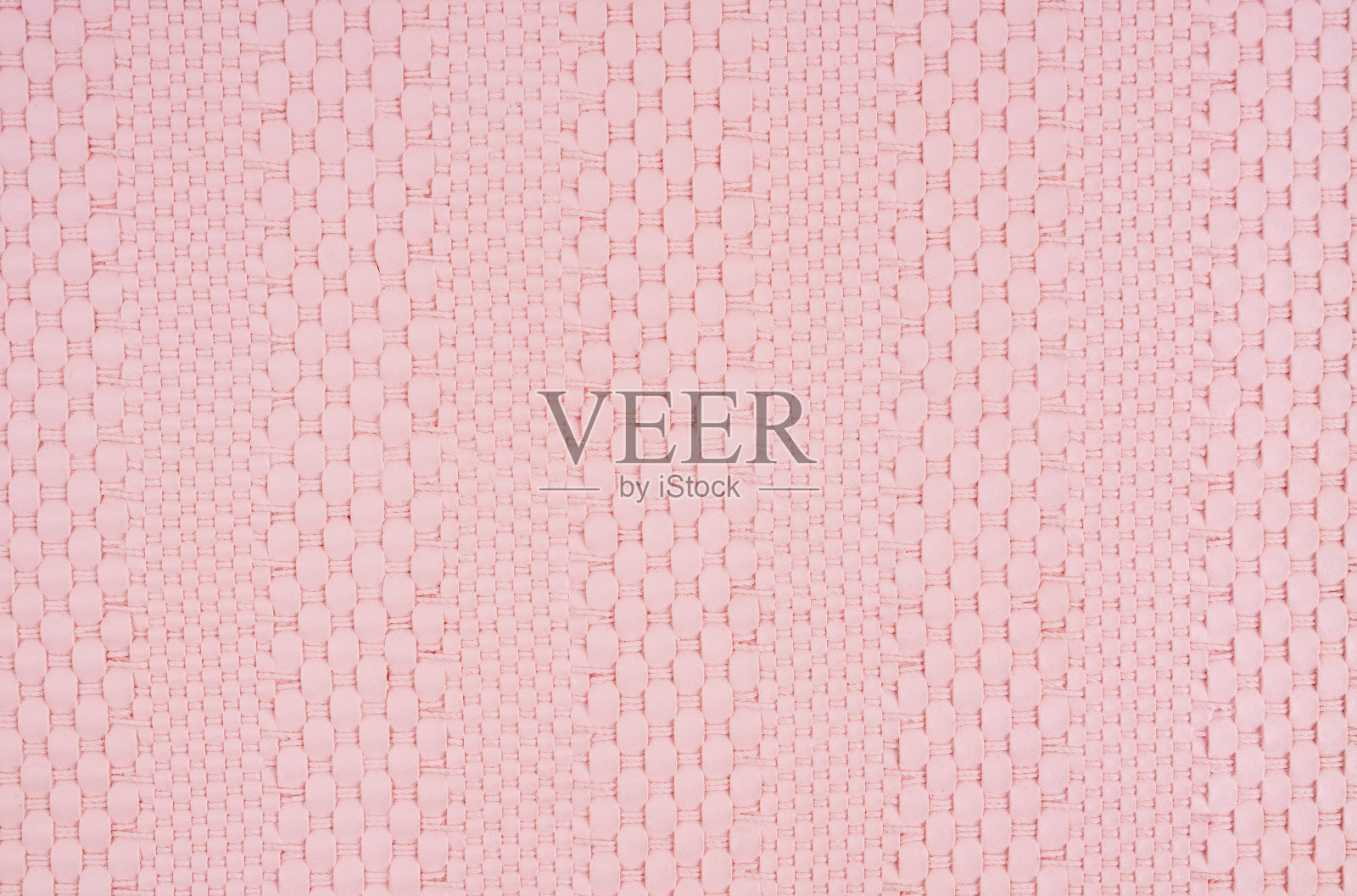 粉红色编织皮革纹理图案。照片摄影图片