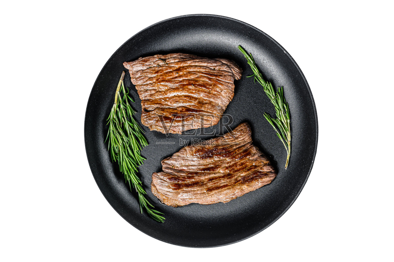 在平底锅里烤平铁和侧翼牛排。大理石牛肉。孤立,白色背景。照片摄影图片