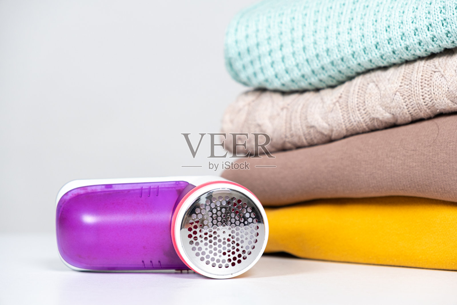 用来去除衣服上毛球的防起球剃刀,用来放文字的地方。衣物护理装置照片摄影图片