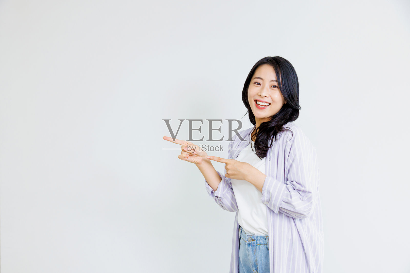 用手指的亚洲女人照片摄影图片