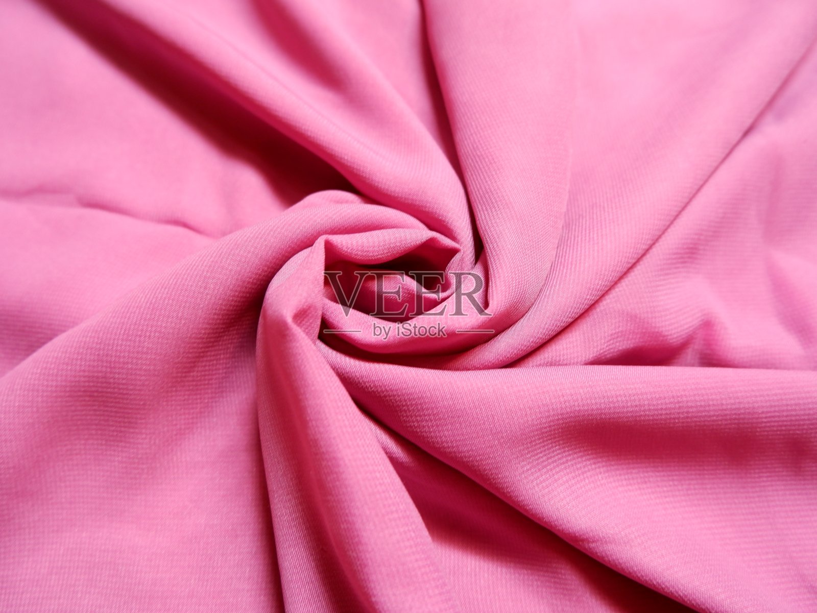 粉红色的织物纹理与美丽的近距离细节,适合工艺项目和缝制衣服。照片摄影图片