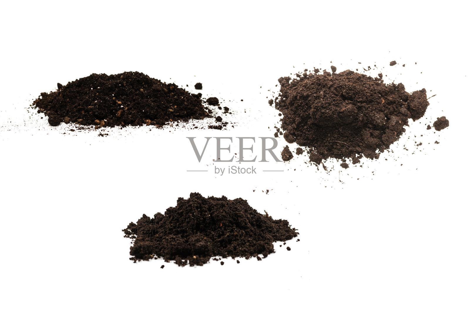 一把泥土孤立在白色的背景上。照片摄影图片