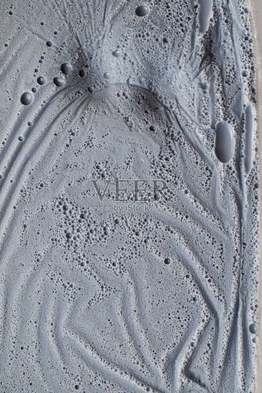 浅蓝色的奶油泡沫的特写照片照片摄影图片