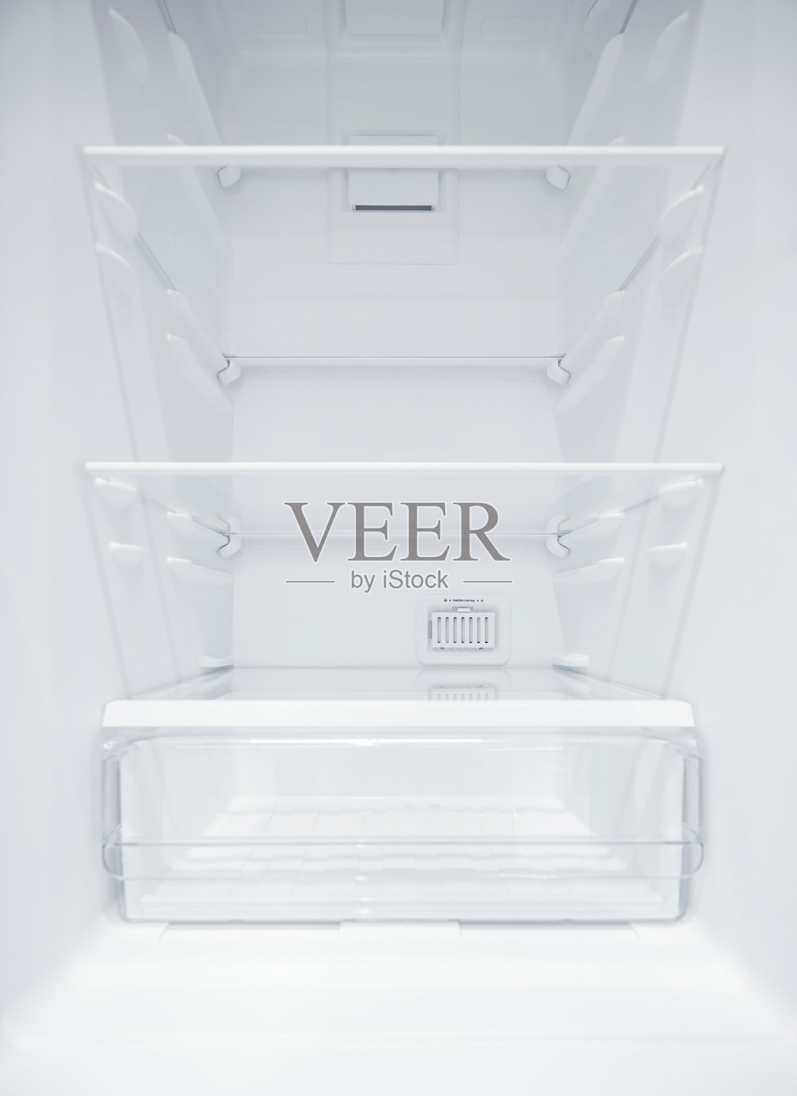 空冰箱。在一个空的,干净的冰箱内,解冻后的冰箱隔间。用广角镜头拍摄照片摄影图片