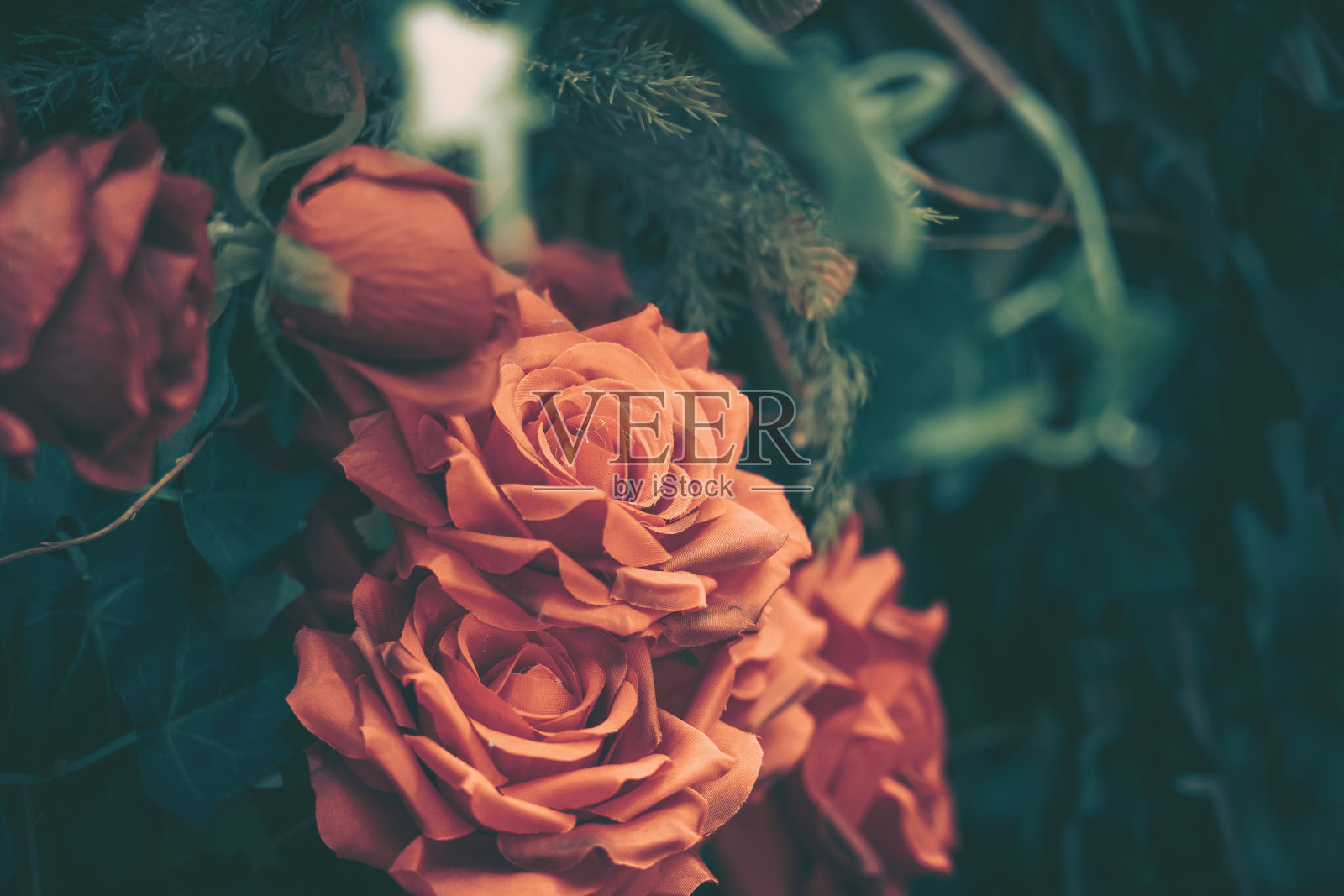 美丽的人造玫瑰背景,复古风格;照片摄影图片