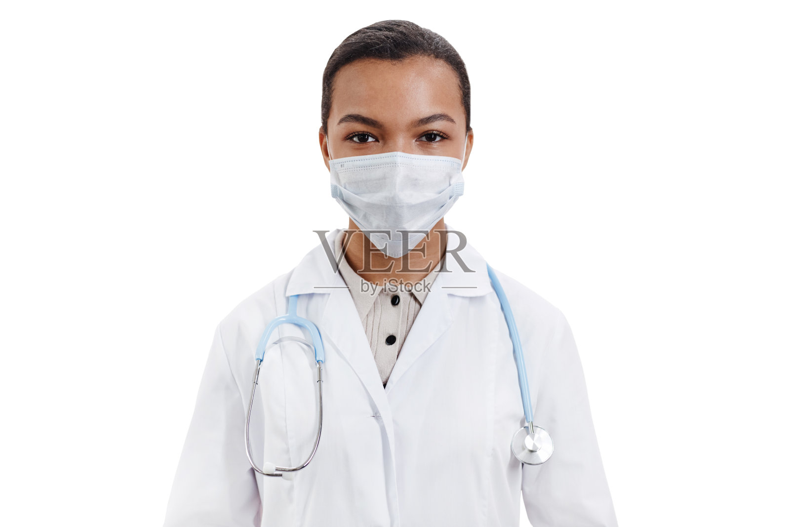 戴着口罩看着镜头的女医生照片摄影图片