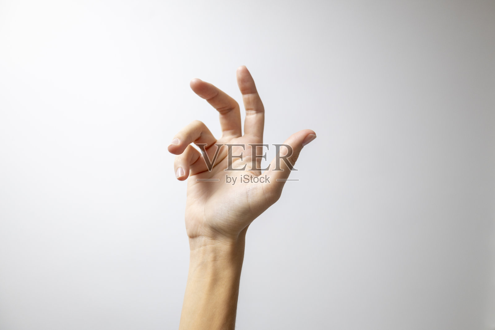 放松的手放在白色的背景上照片摄影图片