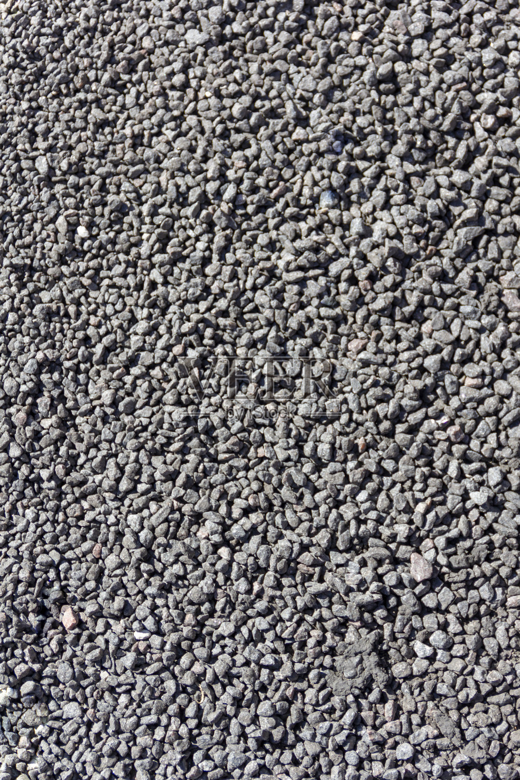 许多灰色小石头-纹理背景图案。照片摄影图片