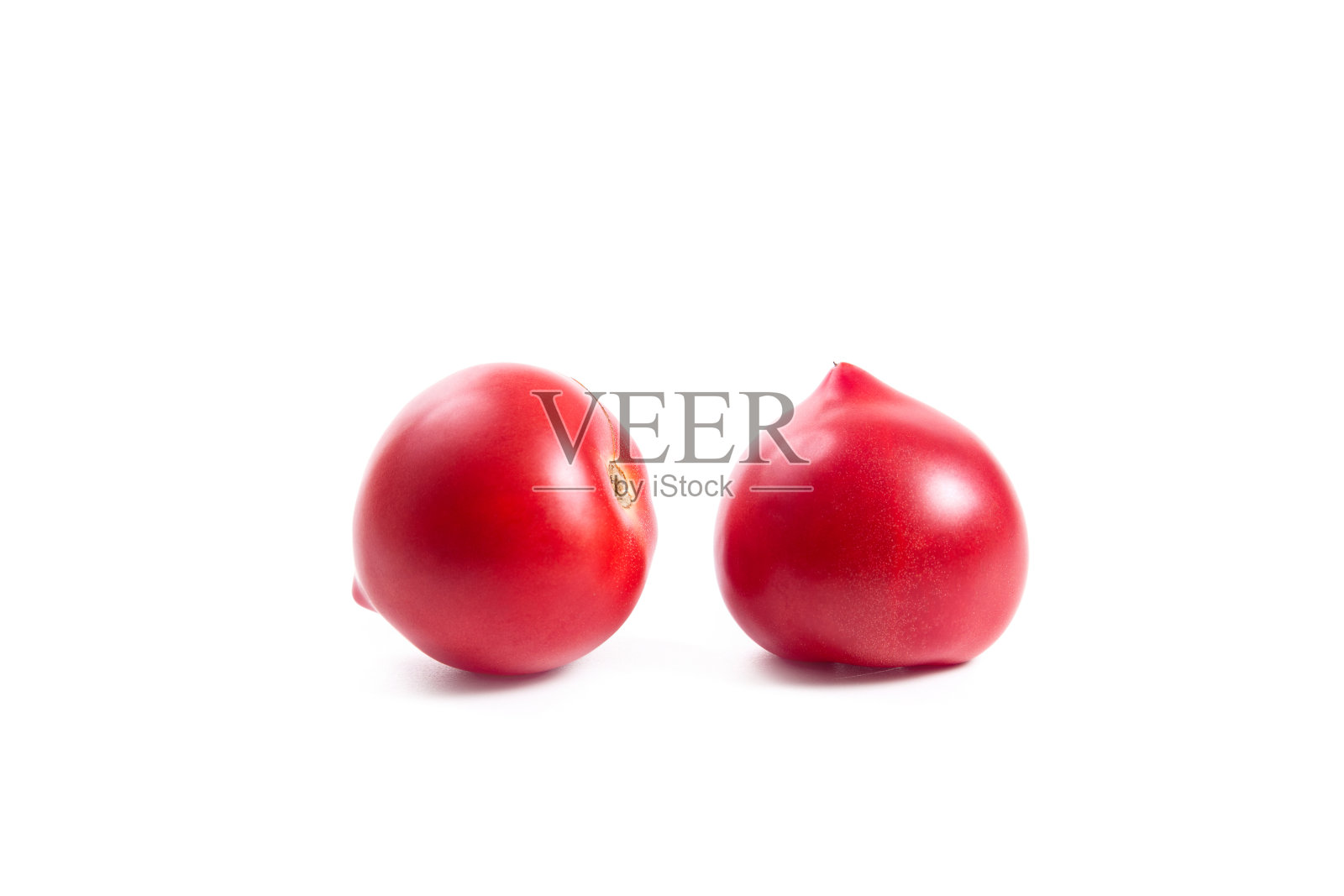 两个粉红色的番茄孤立在白色的背景上照片摄影图片