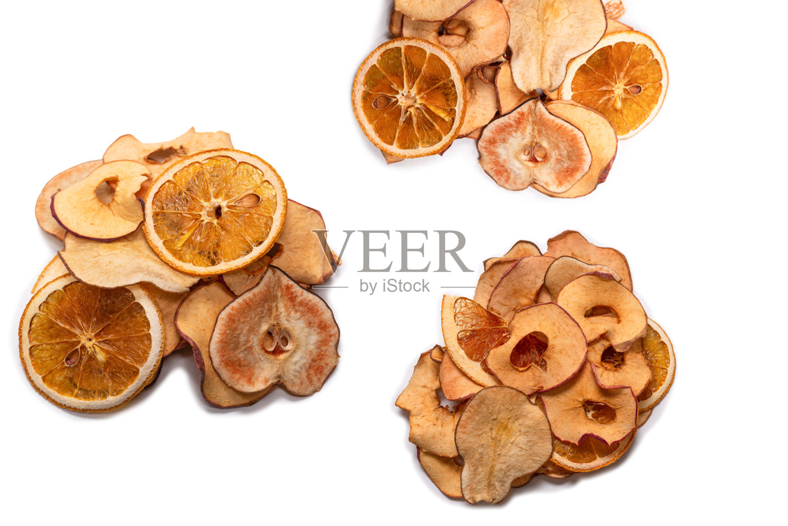 在白色背景上孤立的干果。干葡萄柚,干苹果,干梨。照片摄影图片