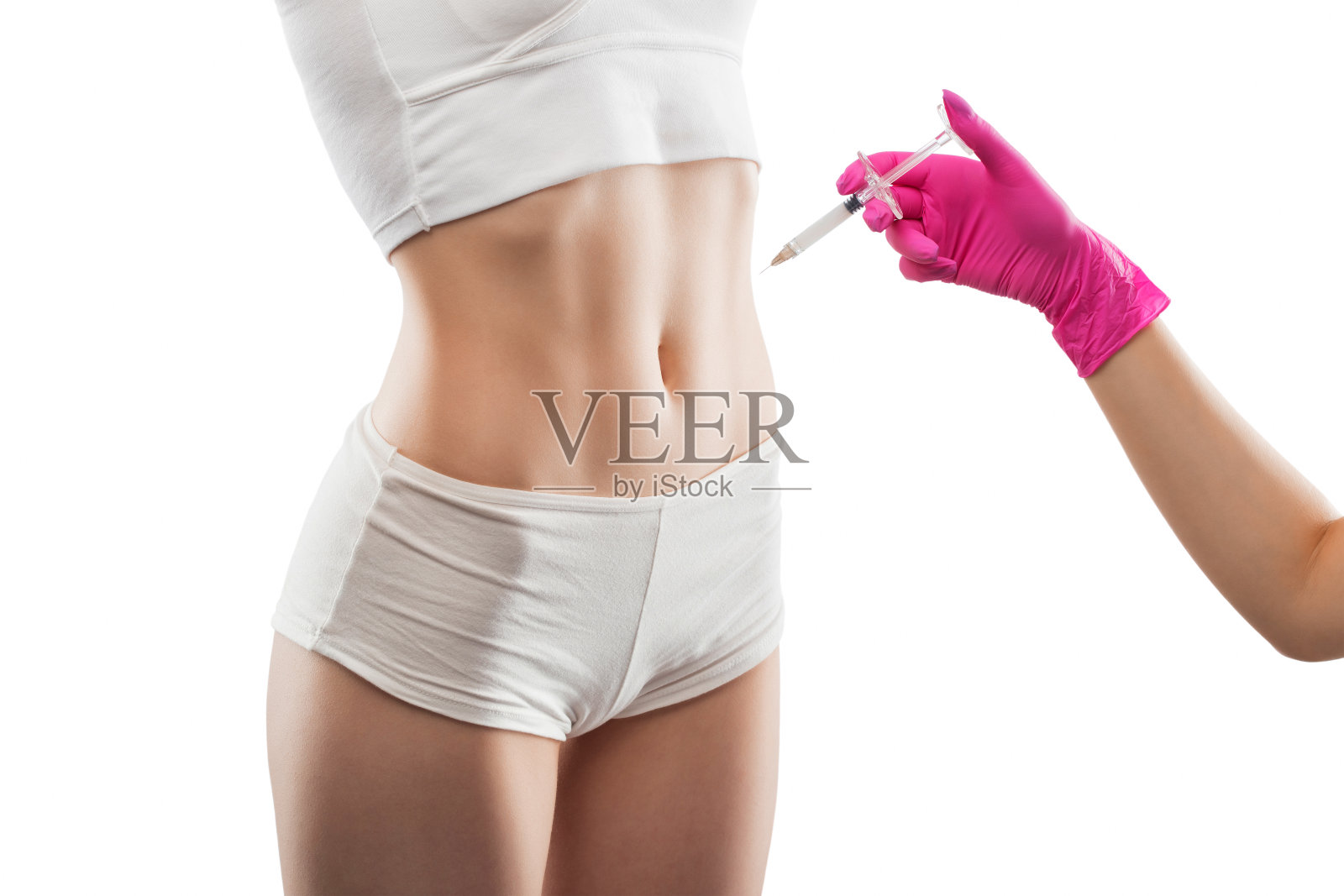 美容师为女性注射脂肪分解剂。美容院的女性审美美容。美容的概念。照片摄影图片