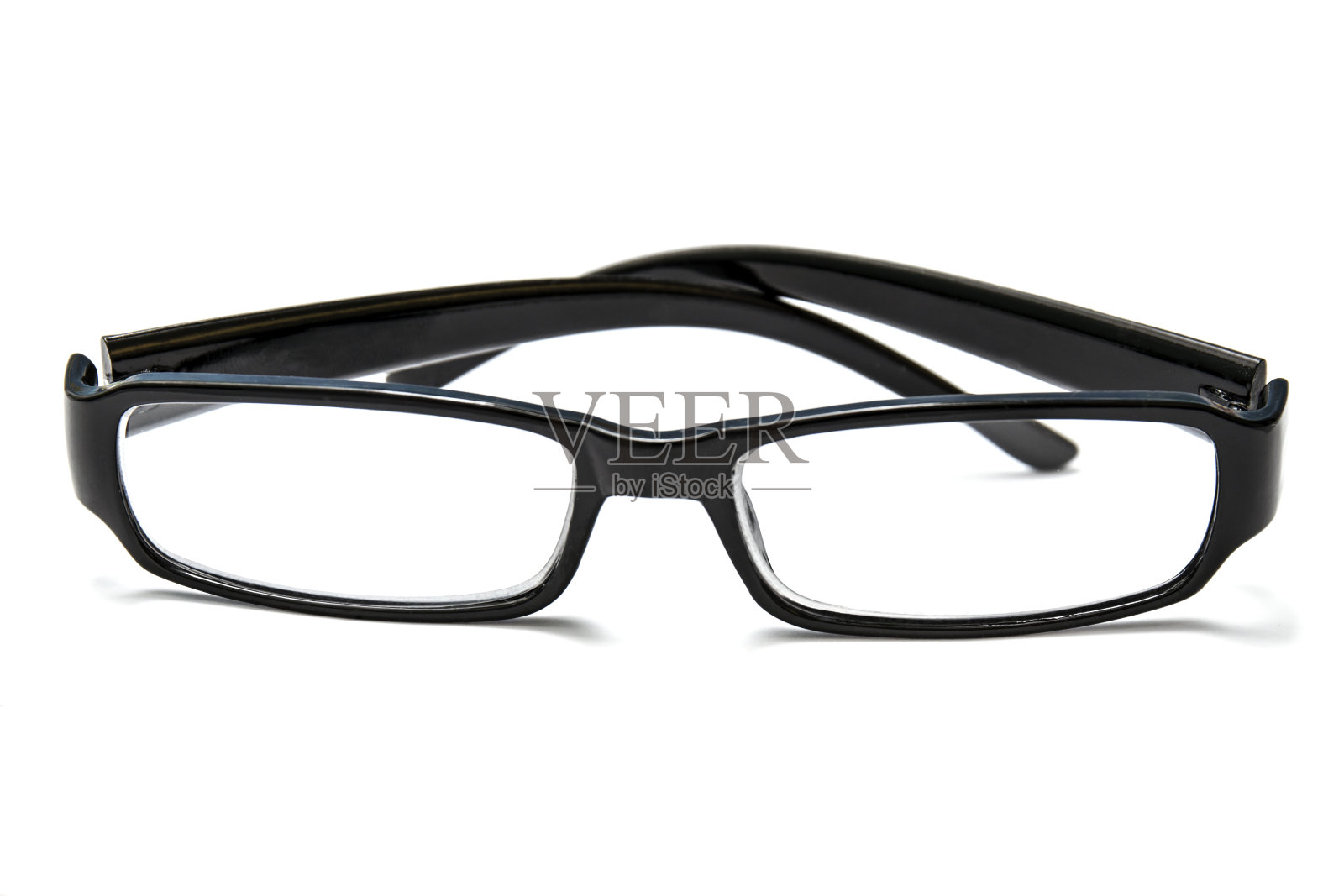 黑色的眼镜被白色隔开照片摄影图片