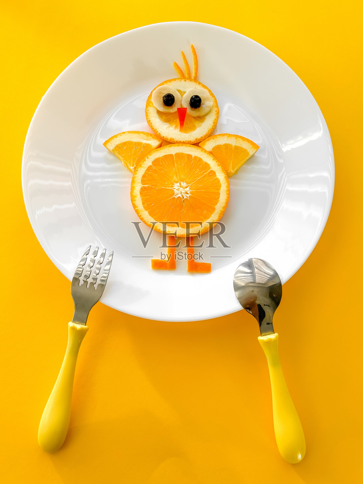 儿童趣味食品,黄底橙鸡,健康食品,婴儿水果照片摄影图片