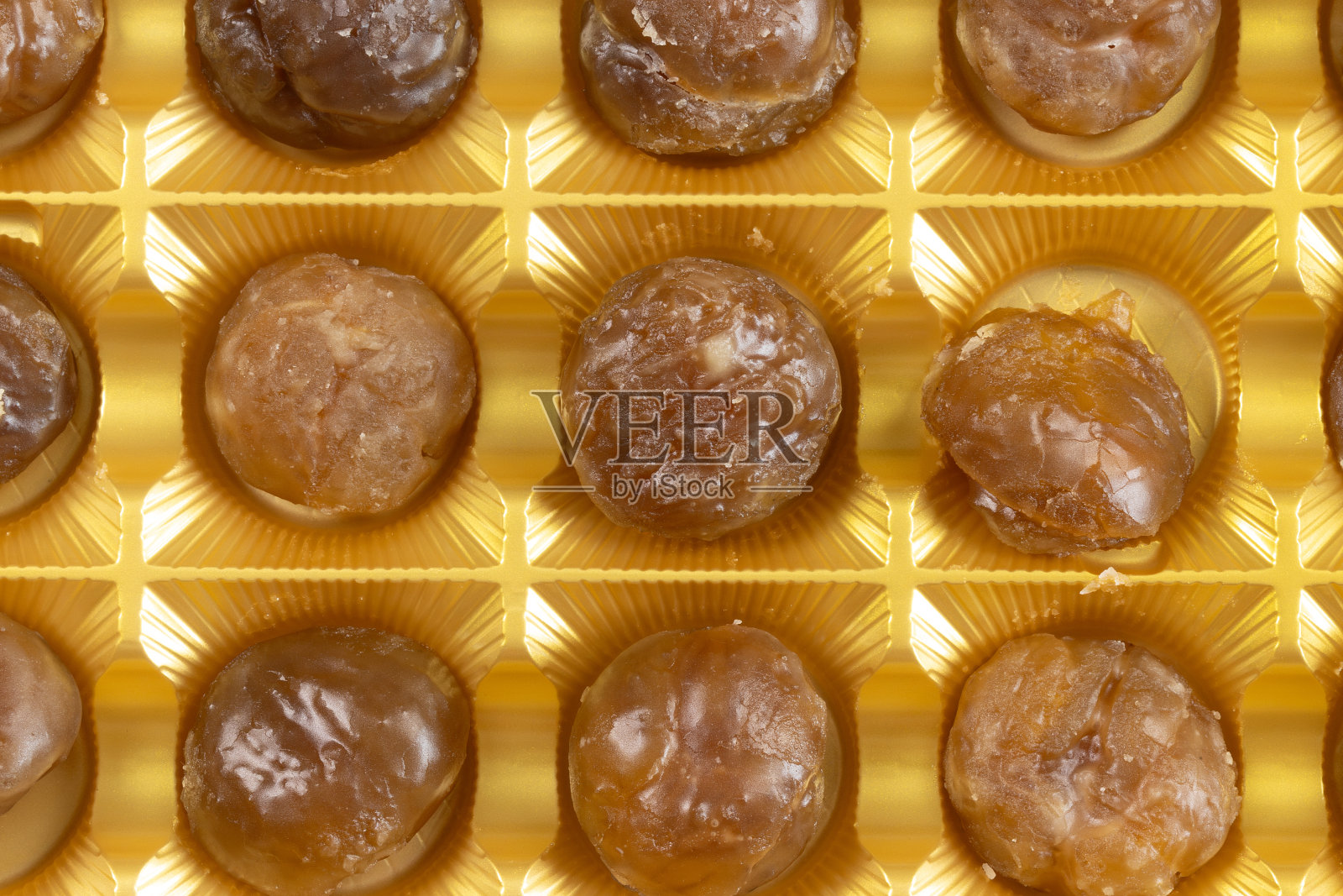 一盘栗子糖,特写照片摄影图片