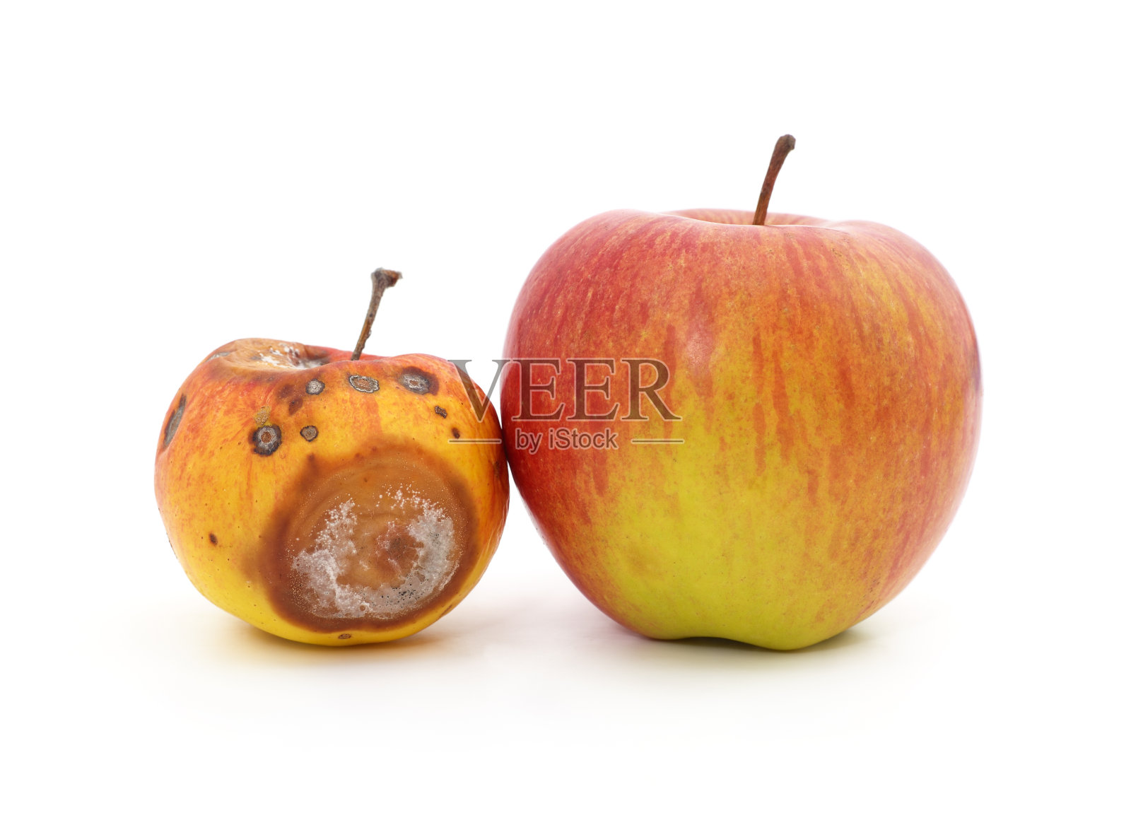 苹果新鲜而腐烂。照片摄影图片