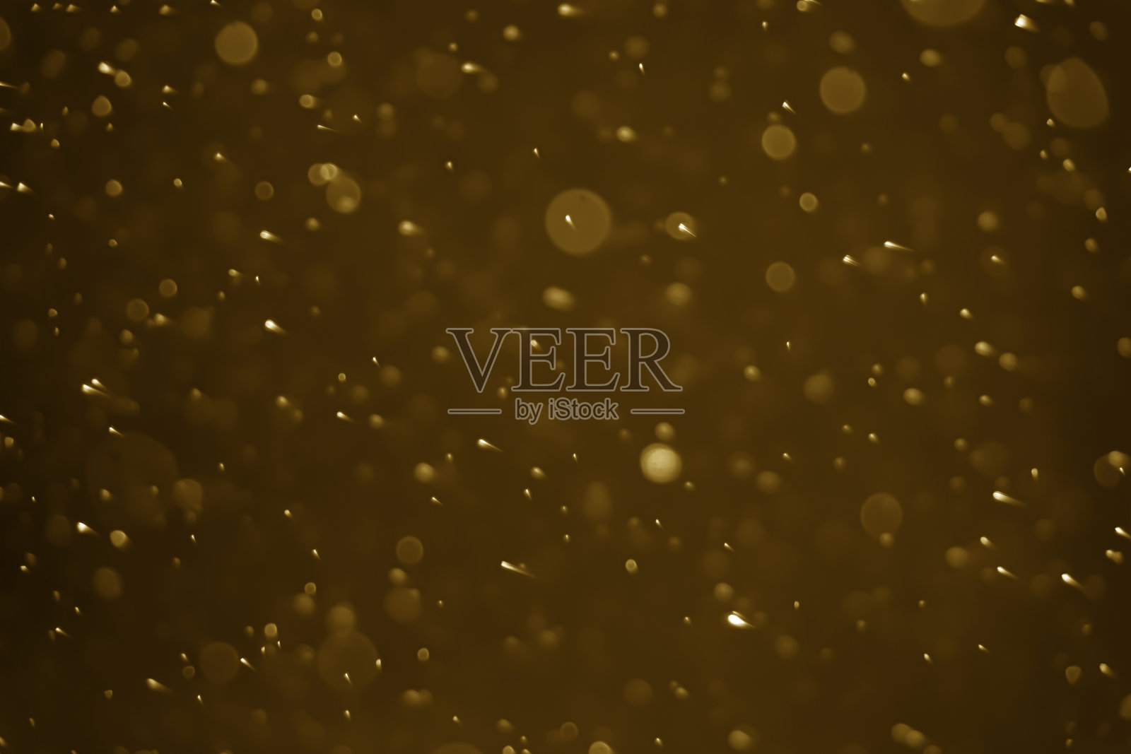 金色背景的抽象散景灯照片摄影图片