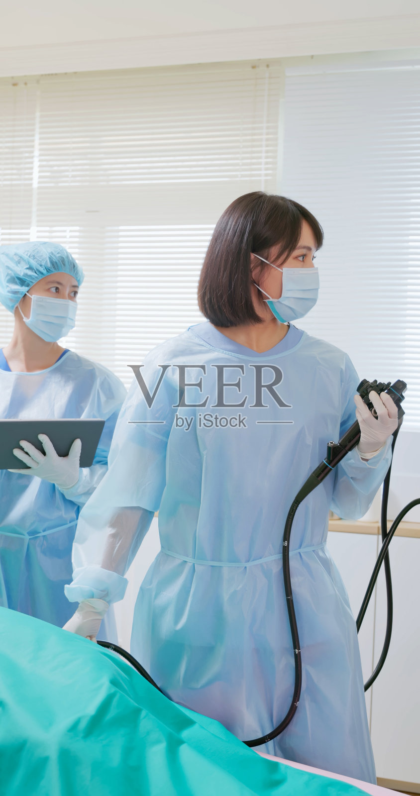 亚洲医生结肠镜检查病人照片摄影图片