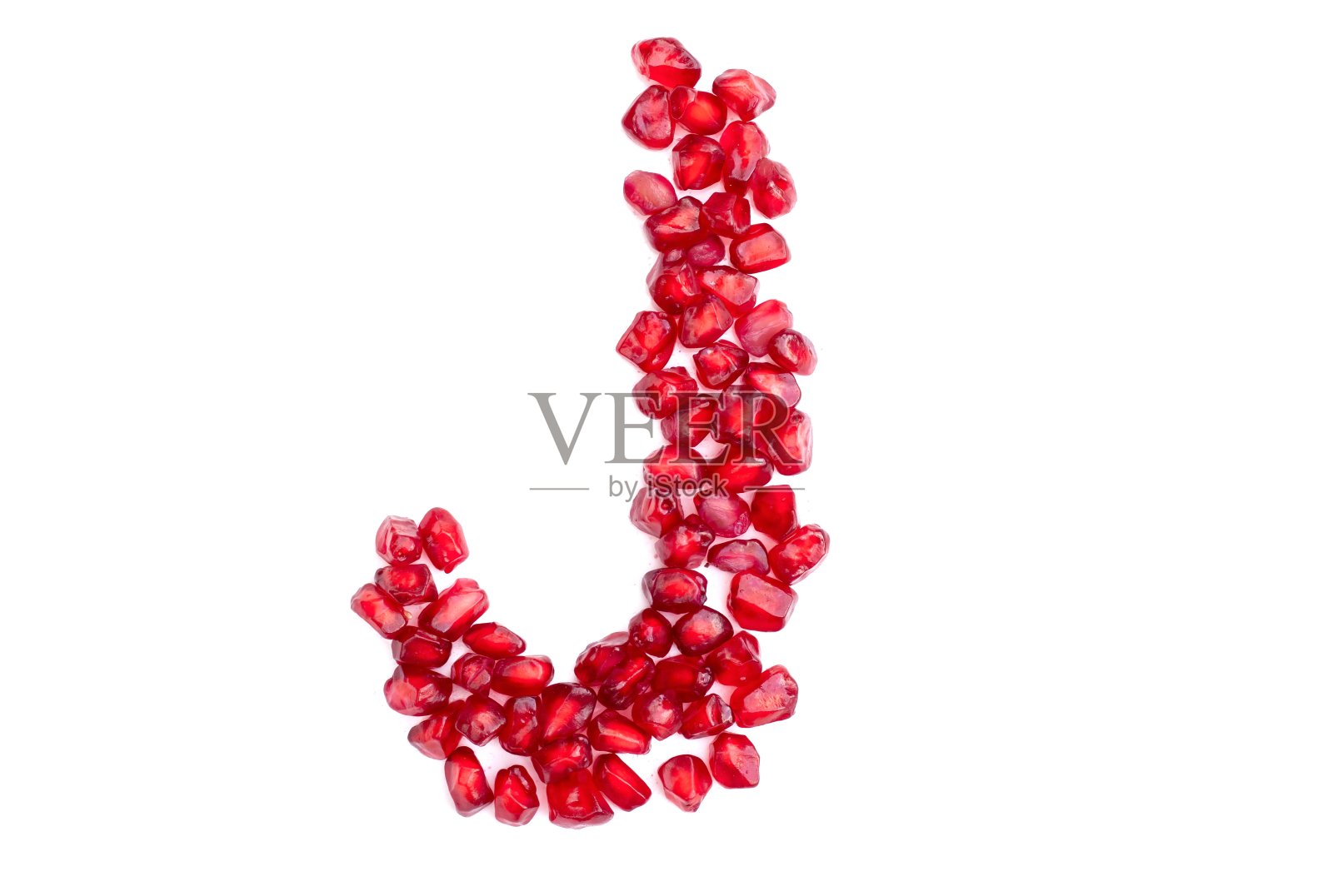 英文字母大写字母写石榴籽隔离在白底照片摄影图片