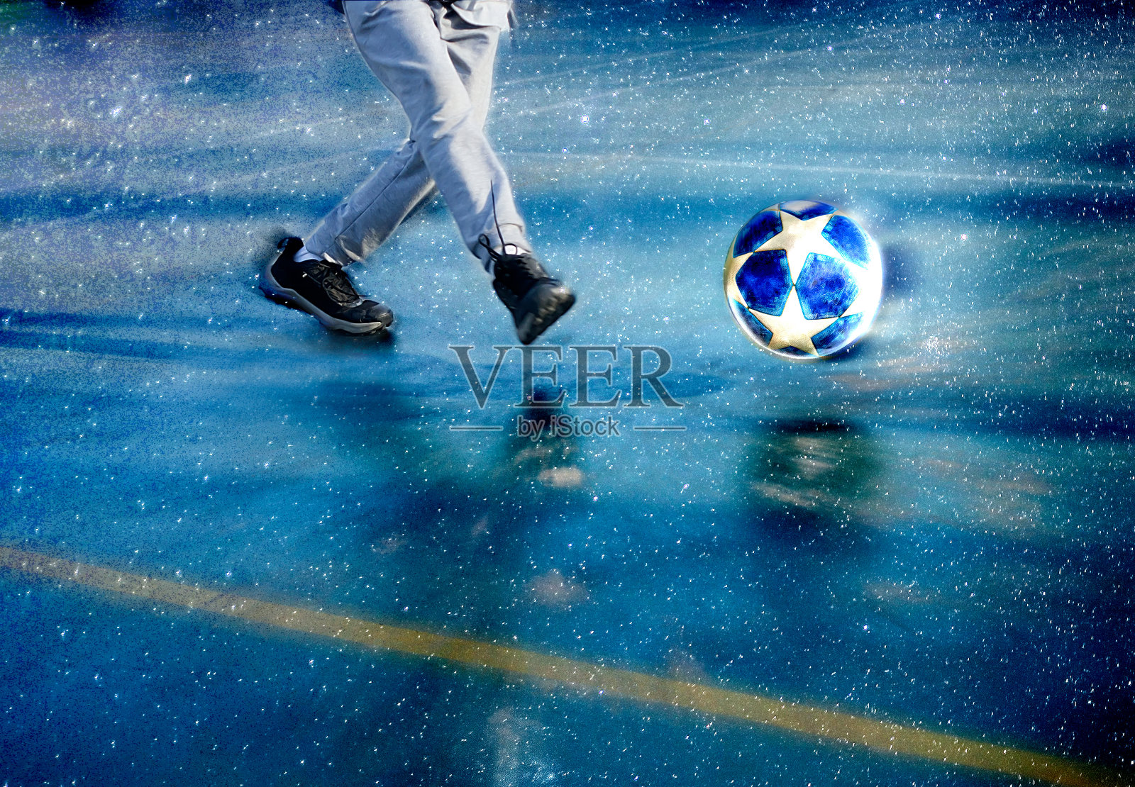 男孩在太空背景中踢球照片摄影图片