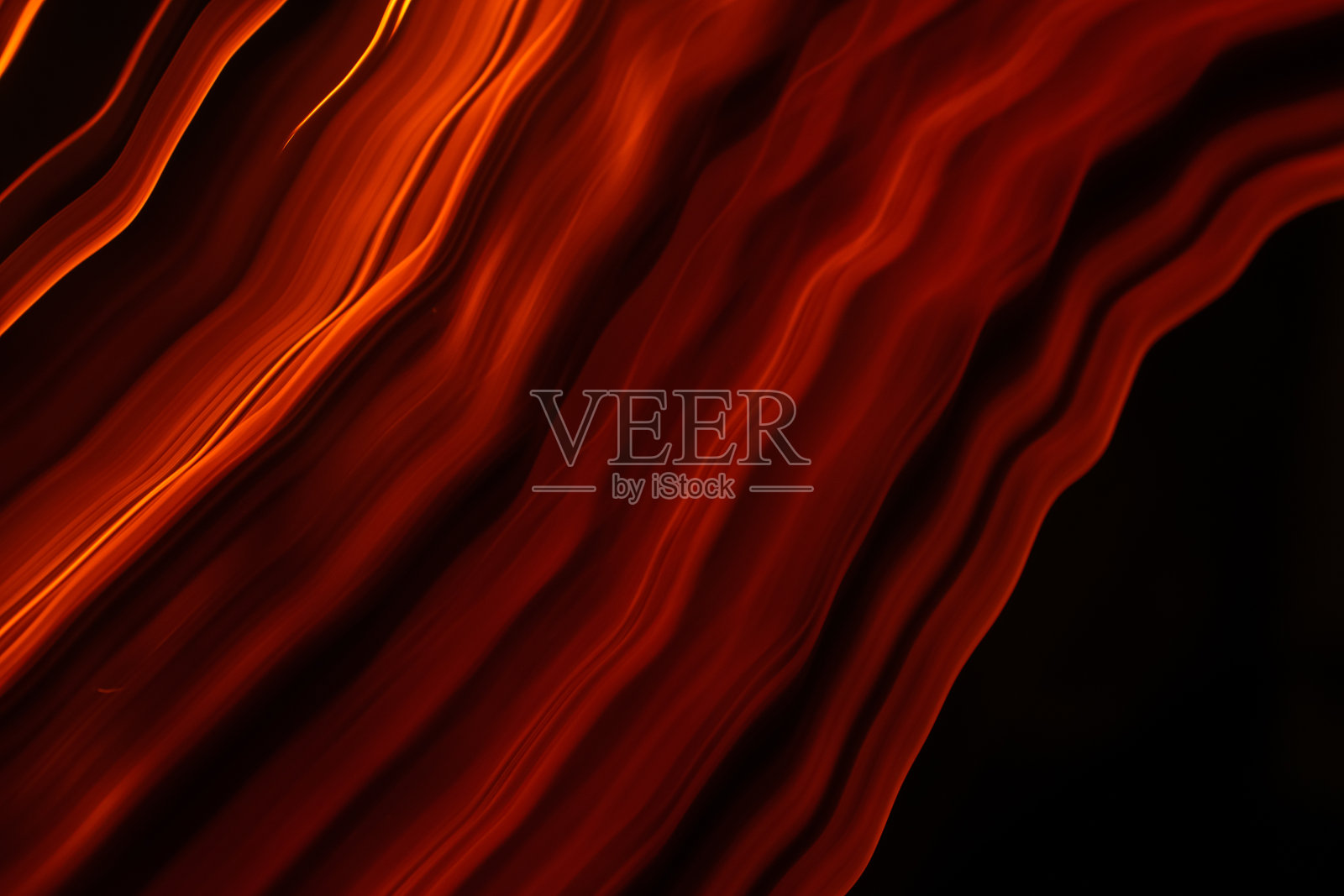 燃烧的纸波,发光的纸边,长时间曝光照片摄影图片