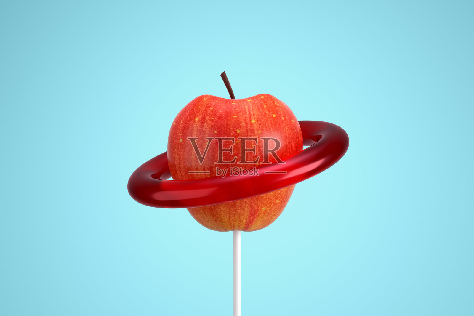 轨道在蓝色背景上的红苹果行星。照片摄影图片