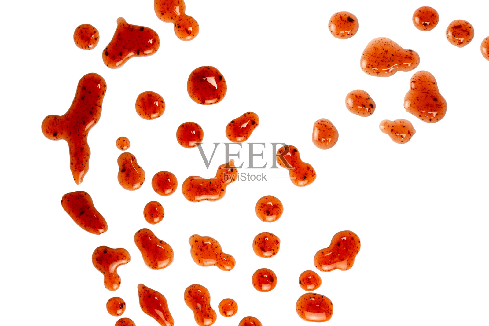 红色的果酱溅在白色的背景上。照片摄影图片