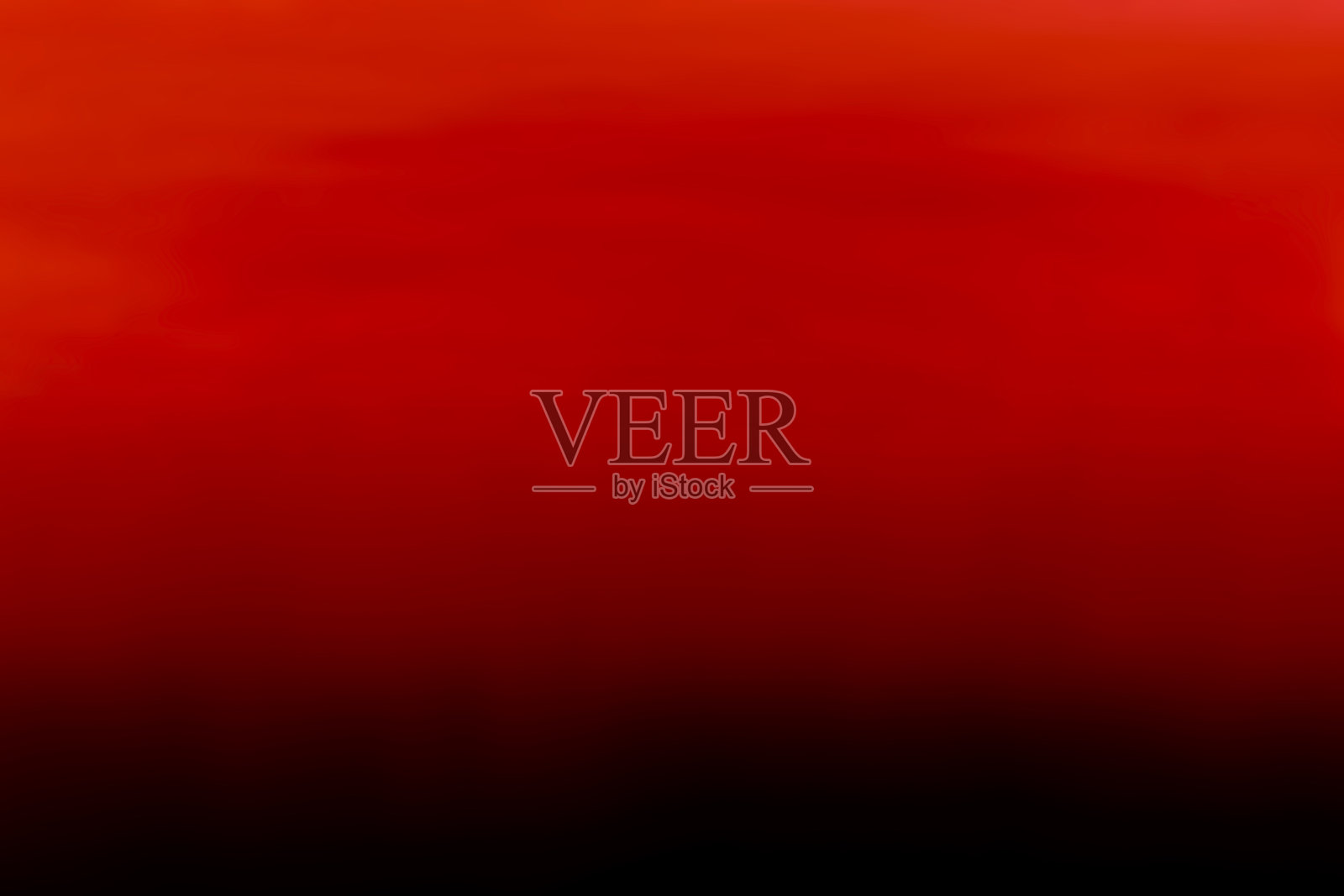 苍白斑驳的背景材料,垂直层次从深红色到黑色。照片摄影图片