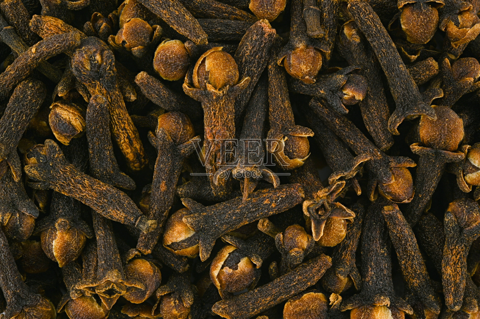 干丁香香料的背景。照片摄影图片