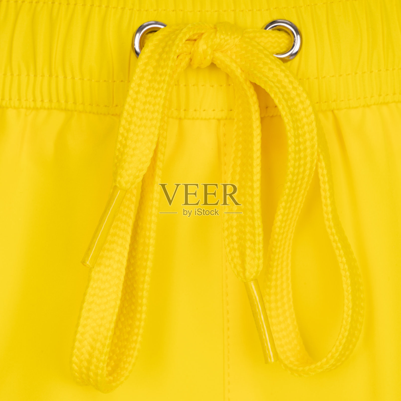黄色游泳短裤特写,细节照片摄影图片