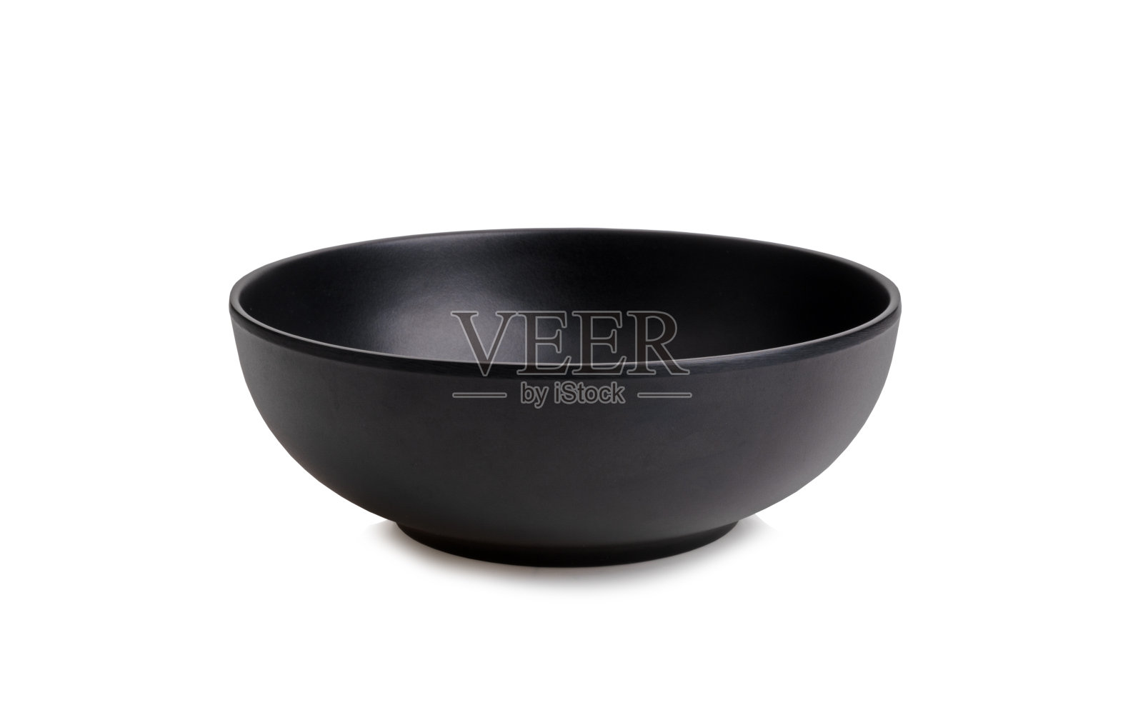 黑色的空碗在白色的黑底上照片摄影图片