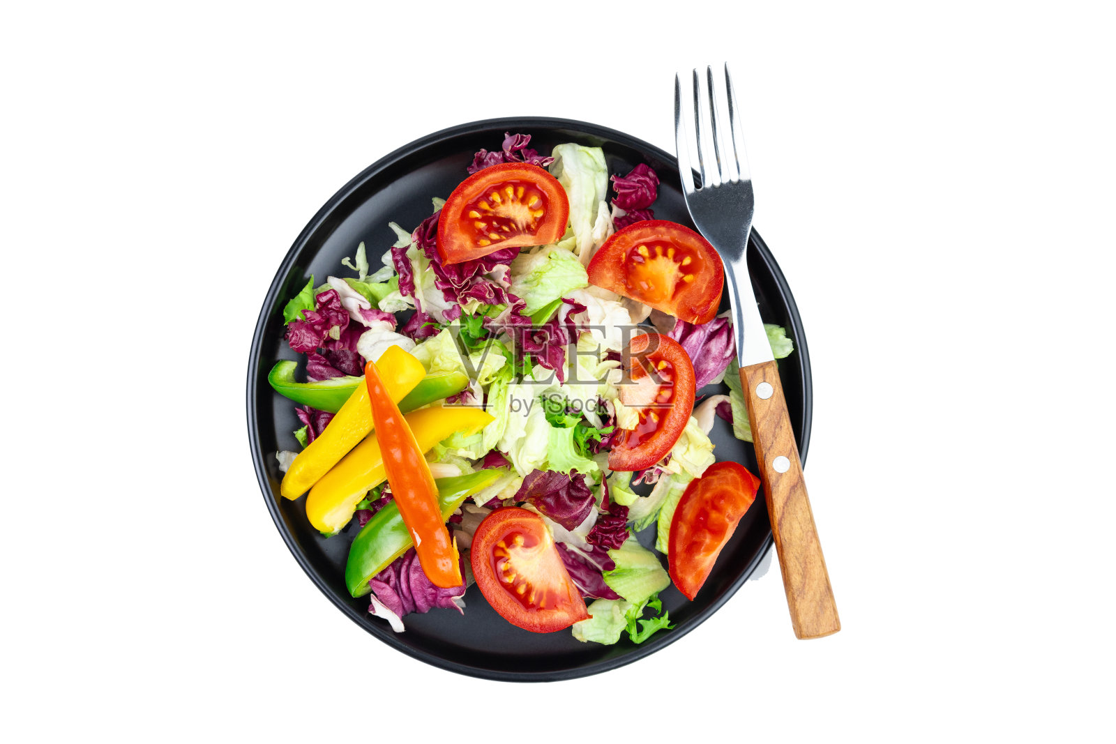 减肥用的蔬菜纯素沙拉用黑色盘子盛在白色盘子里照片摄影图片