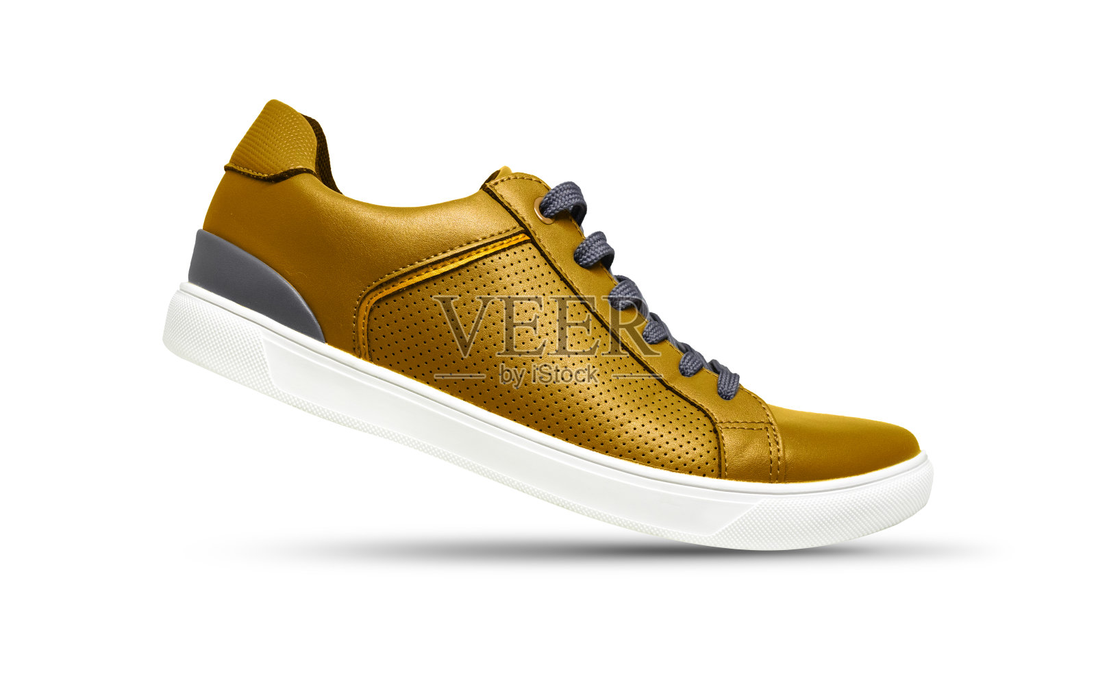 金色运动鞋孤立在白色的背景上照片摄影图片