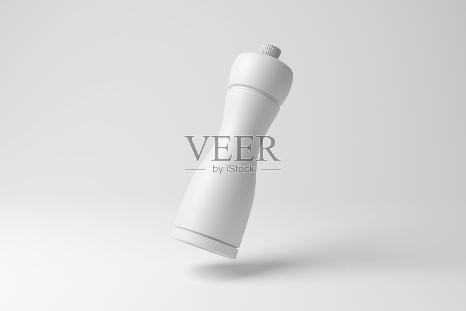 白色香料磨坊漂浮在半空中的白色背景在单色和极简主义。说明调味品的概念,食品的调味和烹调照片摄影图片