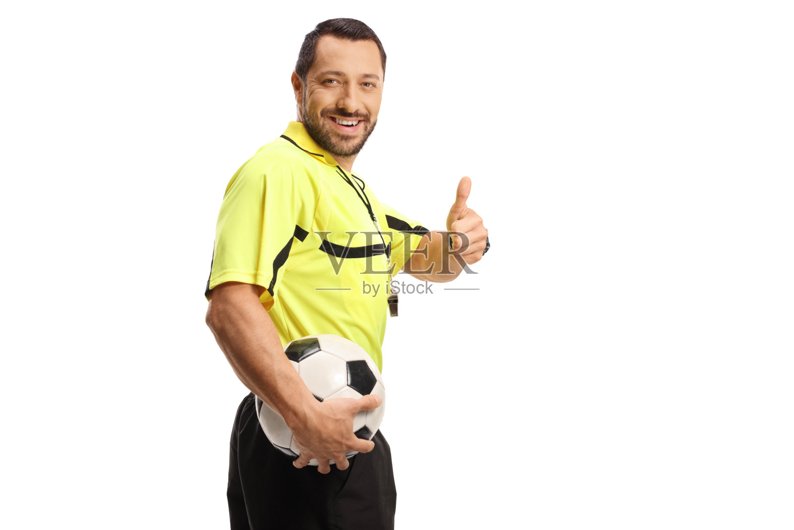 裁判拿着足球,竖起大拇指照片摄影图片