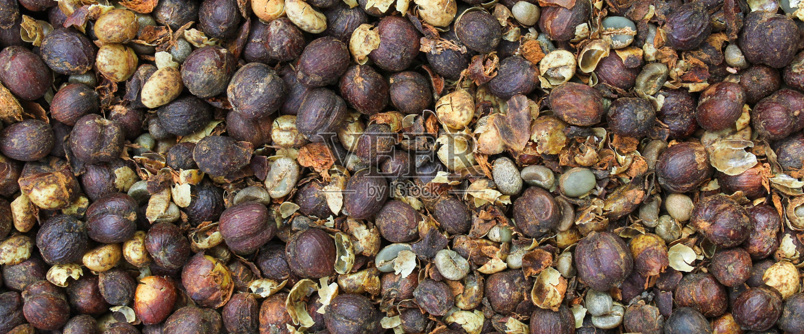 干咖啡豆的质地。咖啡豆背景。照片摄影图片