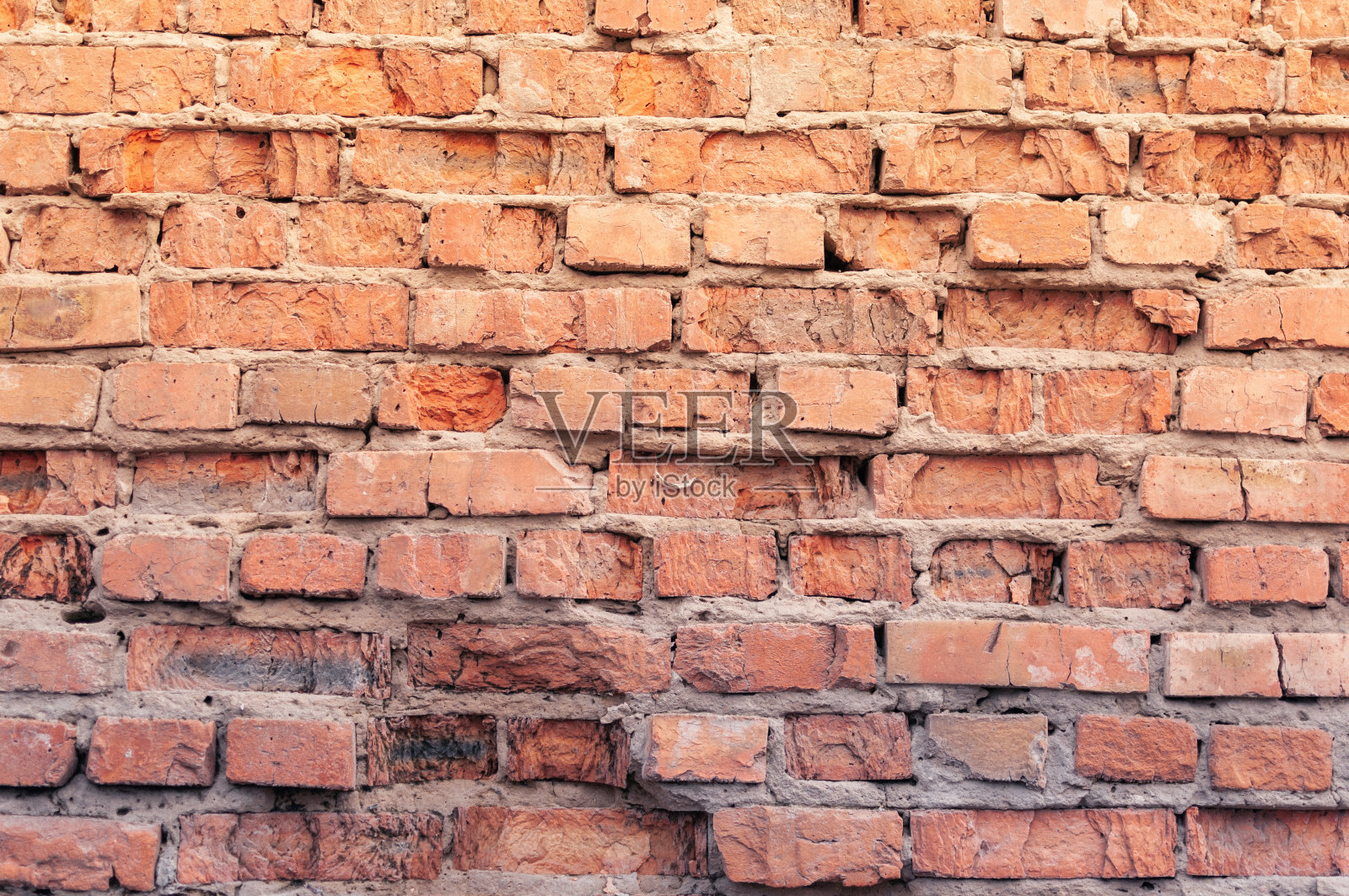 有几个洞的砖墙照片摄影图片