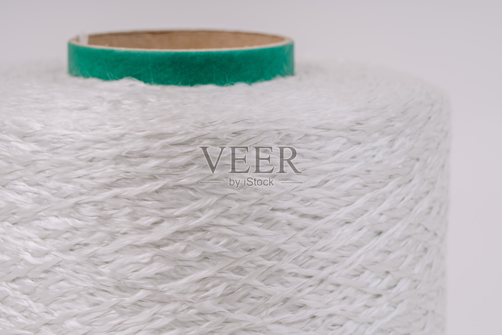 玻璃纤维编织线的特写,展示了材料复杂的纹理和编织。照片摄影图片