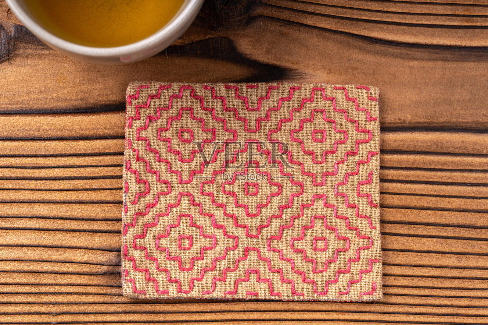 手工佐彦杯垫照片摄影图片