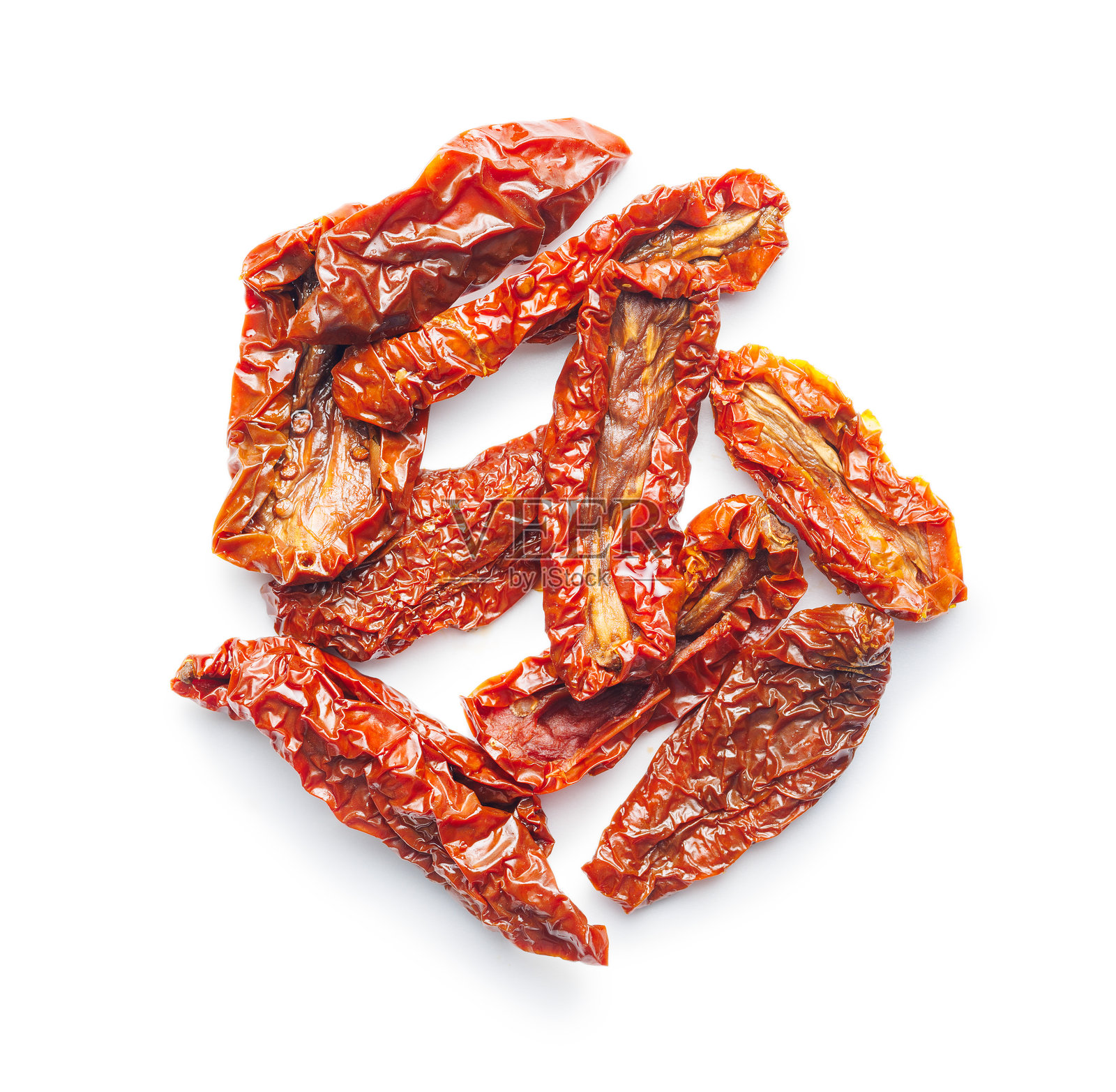 晒干的红番茄孤立在白色背景上。照片摄影图片