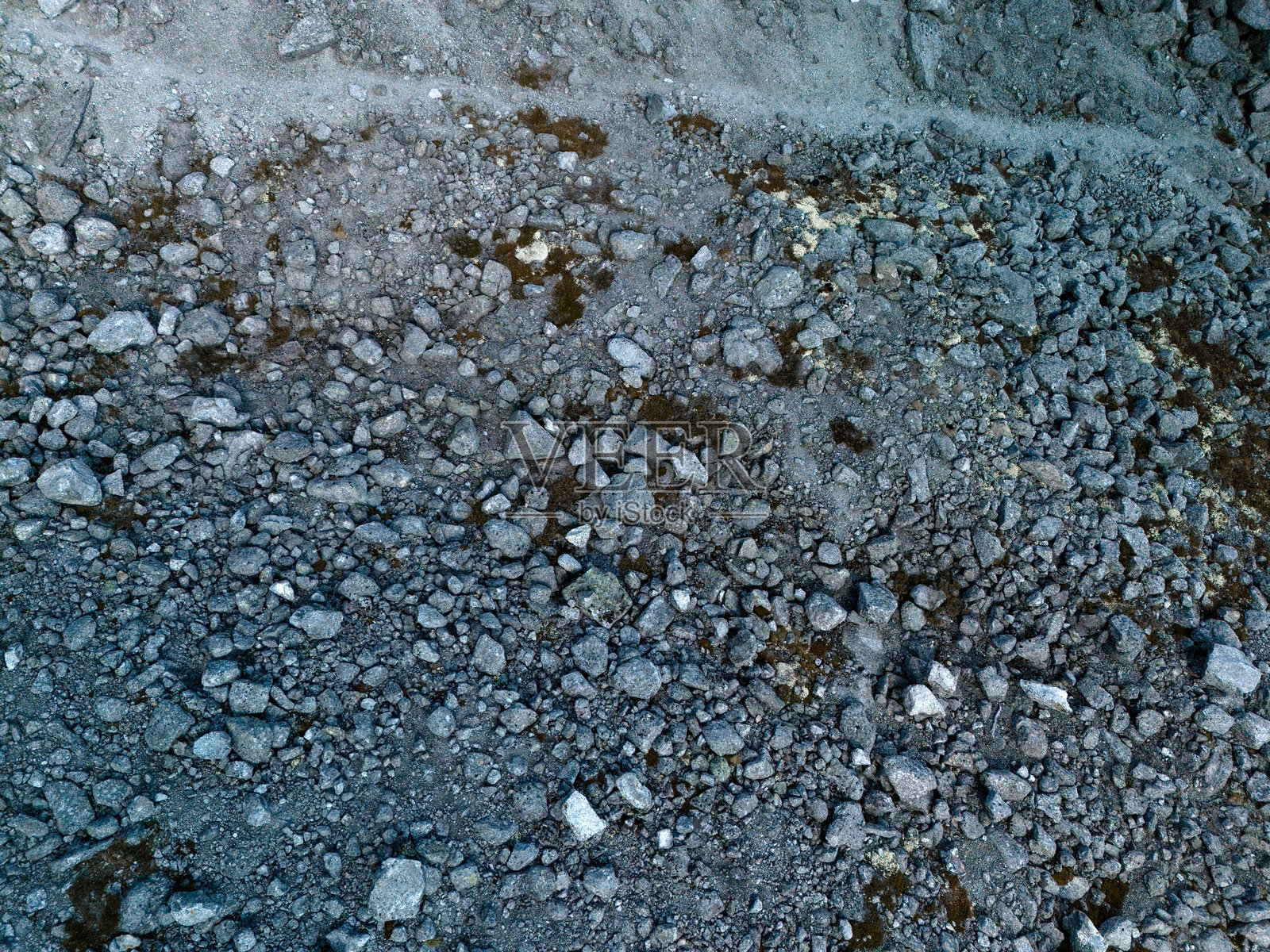 鸟瞰岩石表面,抽象的自然背景照片摄影图片