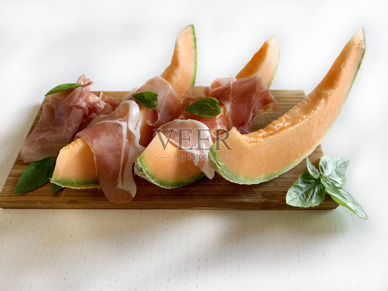 火腿和甜瓜。照片摄影图片