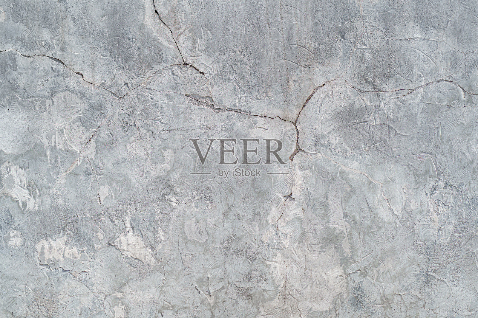 白色灰泥墙上的裂缝。照片摄影图片