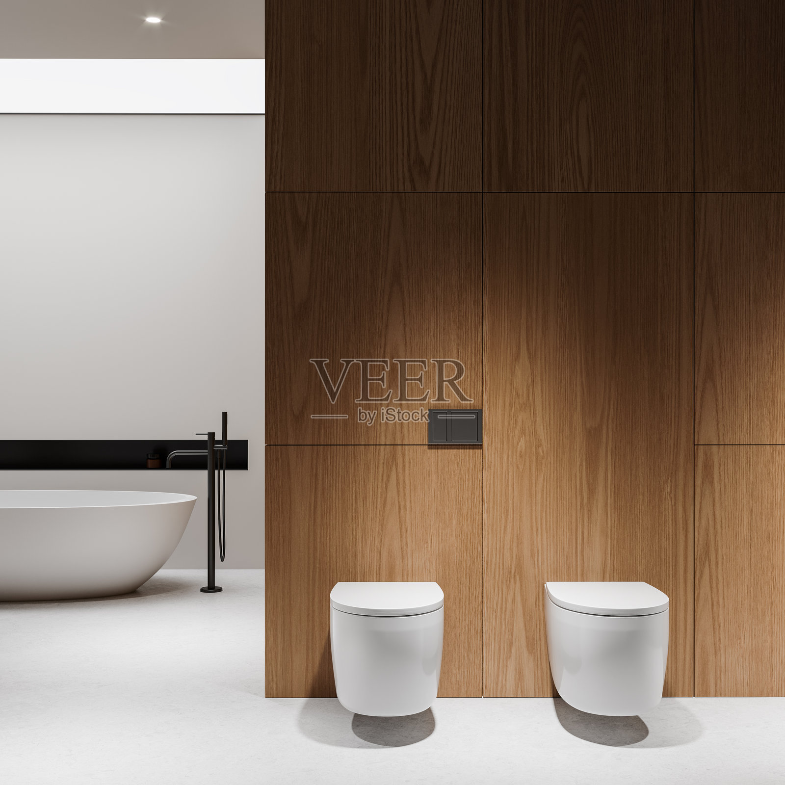 时尚的家居浴室内部,配有两个马桶和一个浴缸,地面为混凝土材质照片摄影图片